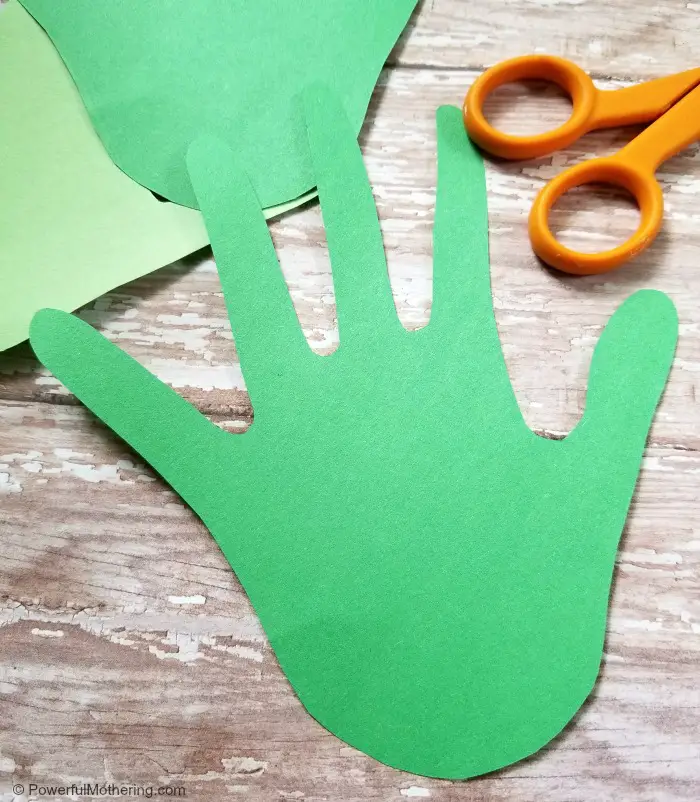 Cutting-out-hand-prints-for-a-family-tree-craft-for-kids