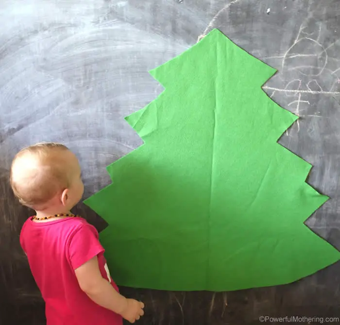 Stick your DIY Felt Christmas Tree to the wall with the poster tape.