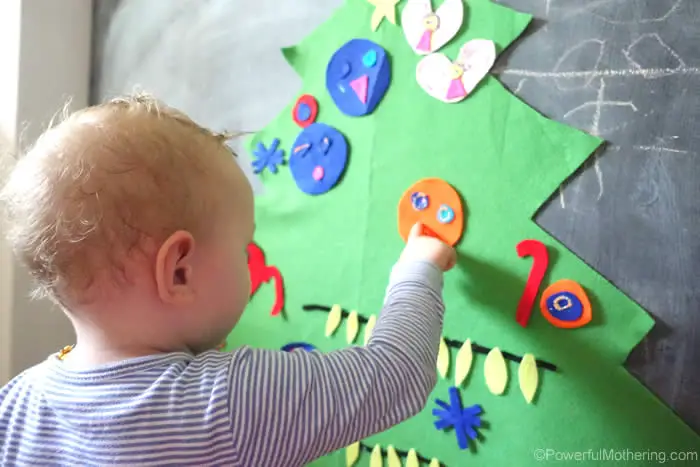 Press the felt ornaments onto the felt Christmas tree. They stick to each other naturally, no need to add anything else.